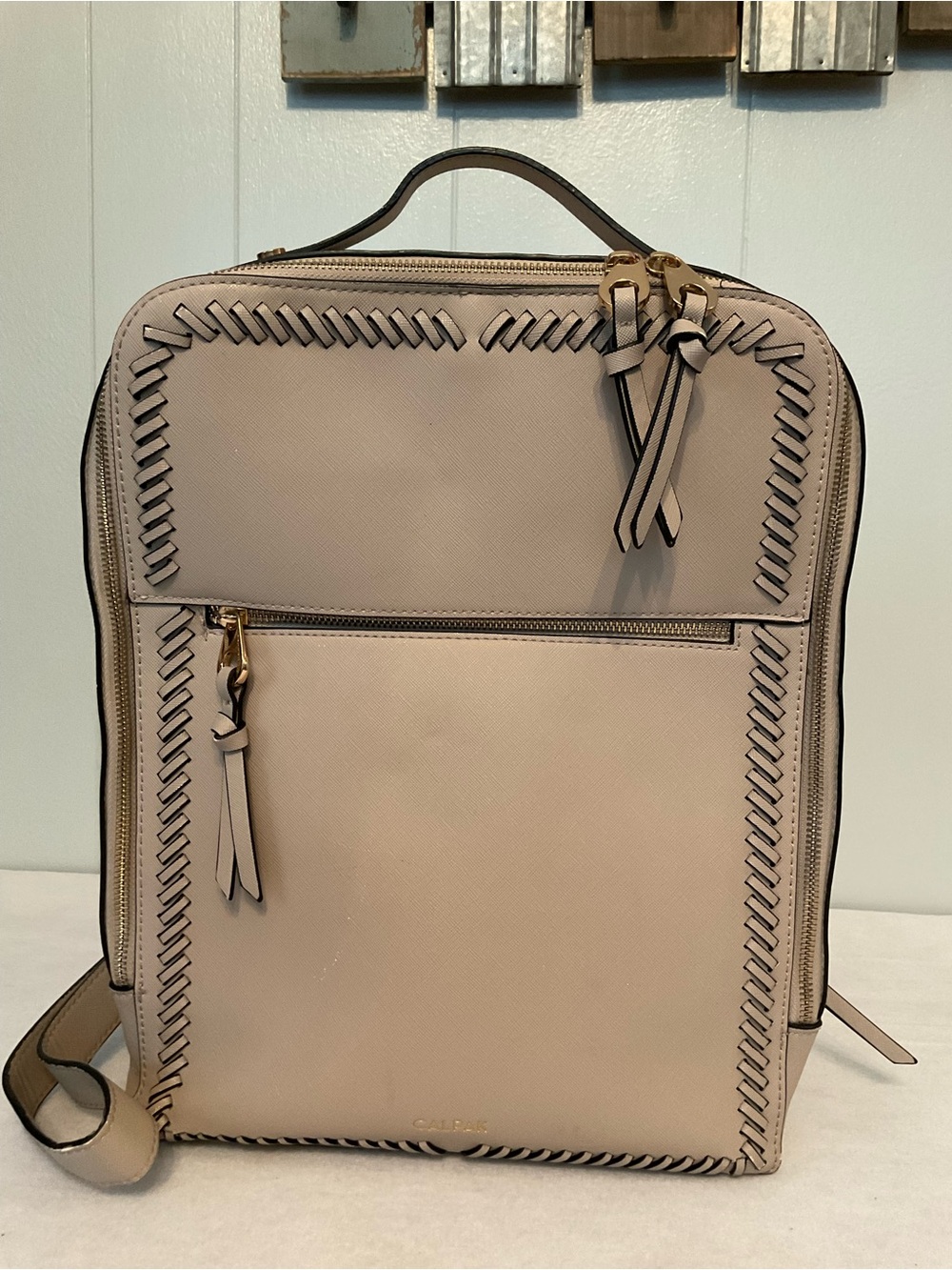 CALPAK Cream Whipstitch Backpack